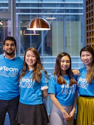 A group of ULaw students smiling and wearing #TeamULaw t-shirts A group of ULaw students smiling and wearing #TeamULaw t-shirts