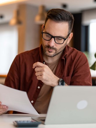 Male reading a document Male reading a document